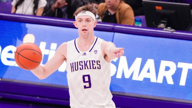 Paul Mulcahy sets up the Husky offense.